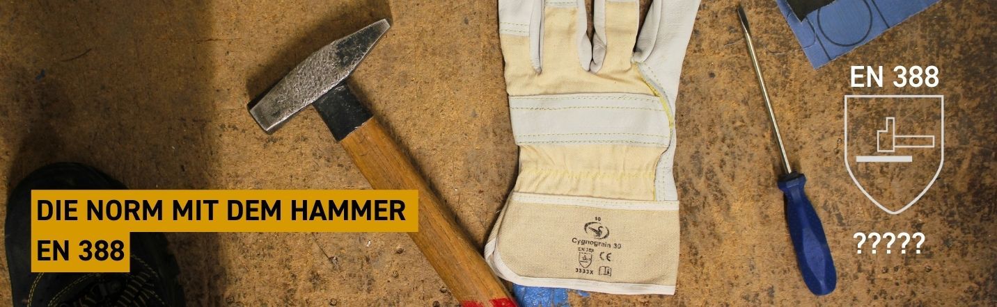 EN Norm 388 - Werkzeuge mit EN 388 zertifizierten Lederhandschuhe auf einer Werkbank