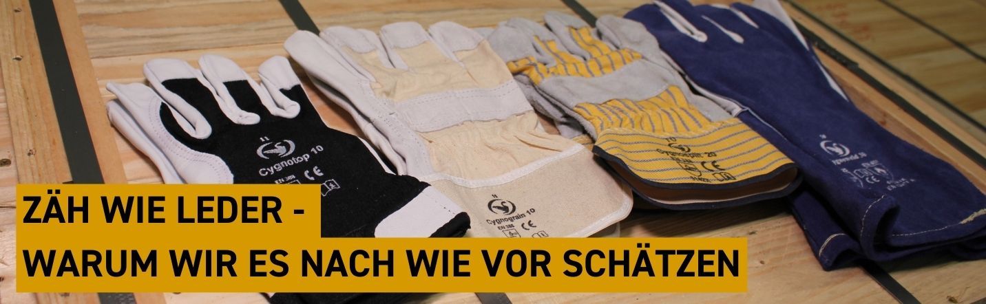 Auswahl an Arbeitshandschuhe aus Leder auf einer Kiste