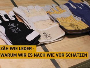 Minibanner Lederhandschuhe auf eine Holzkiste